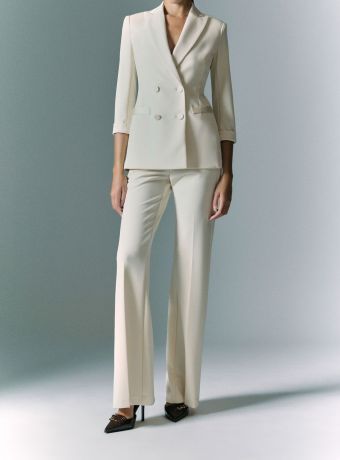 Pantaloni a zampa vita media